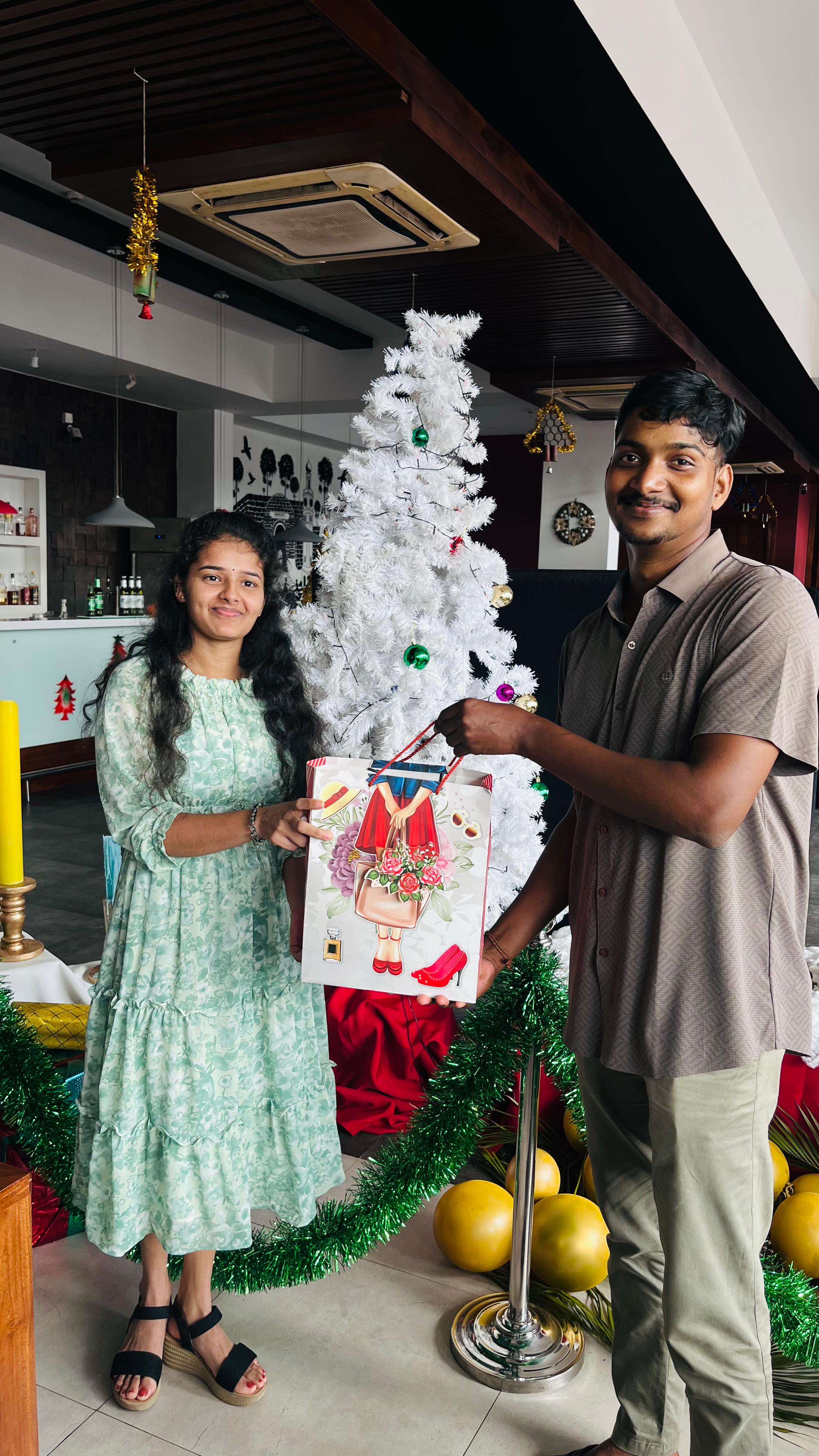 Receiving a gift from the HR manager at the 2024 QTechy year end celebration